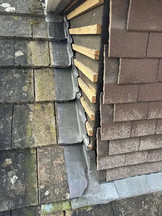 Lead flashing work at a roof junction in Chingford