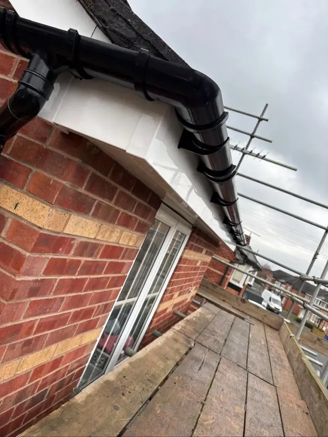 Black guttering installed on a Chingford property