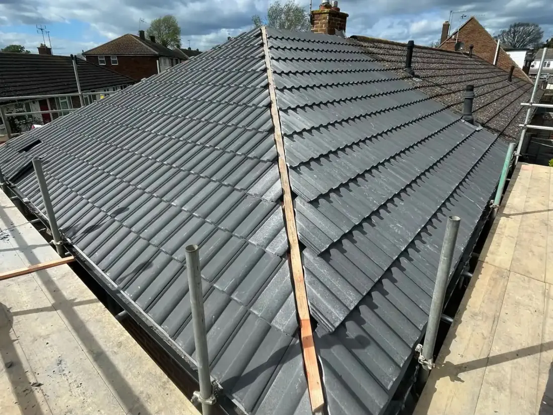 Tiled roof replacement work in progress in Chingford